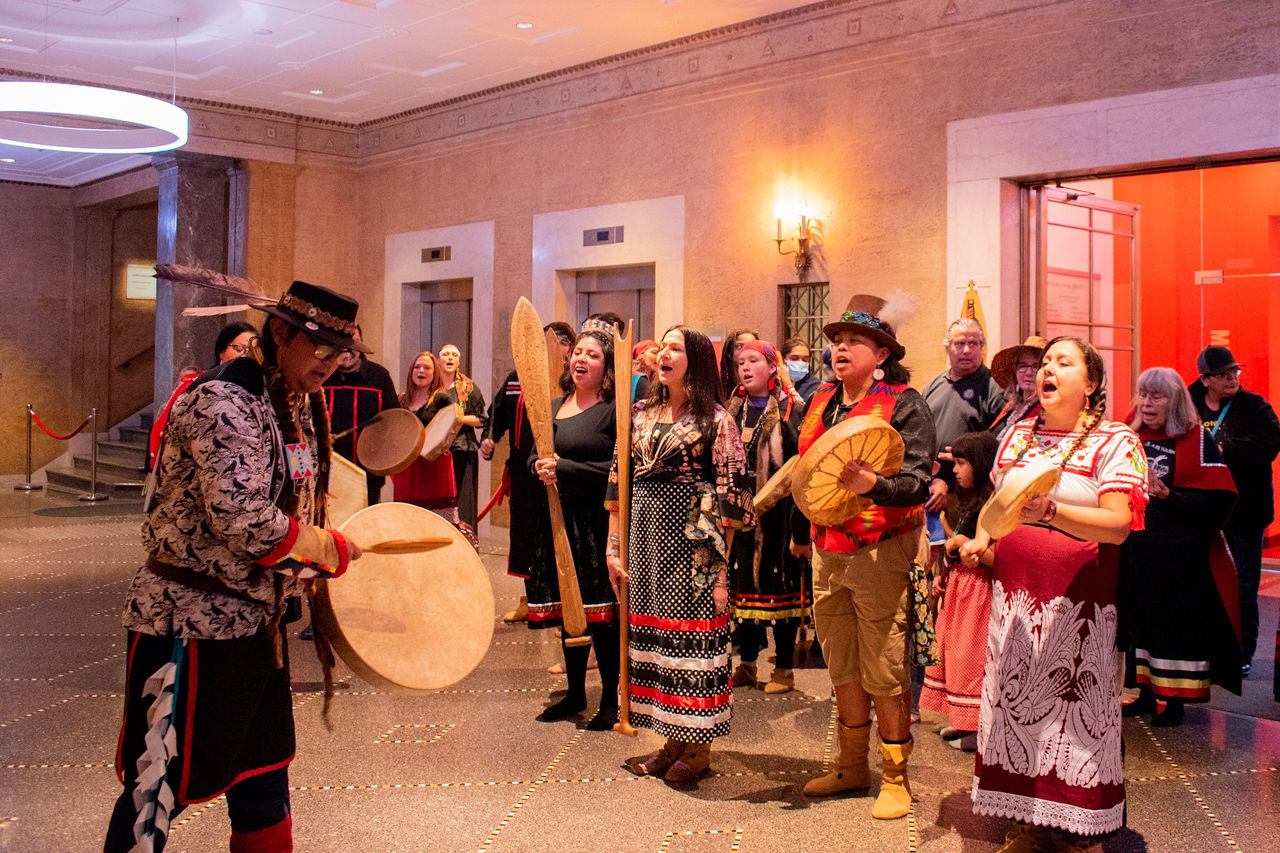Indigenous musicians and community members gathering together